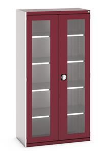 40013064.** Bott Cubio Window Door Cupboard with lockable doors and clear perspex windows. External dimensions are 1050mm wide x 525mm deep x 2000mm high and the cupboard is supplied with 4 x 100kg capacity shelves....